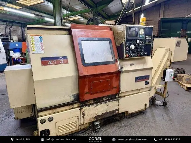 Used OKUMA ACT-3 CNC Turning Centers Slant Bed for sale - Front view showing cabinet and main door assembly