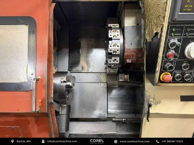 Used OKUMA ACT-3 CNC Turning Centers Slant Bed for sale - Workspace showing 12-station tool turret and spindle nose