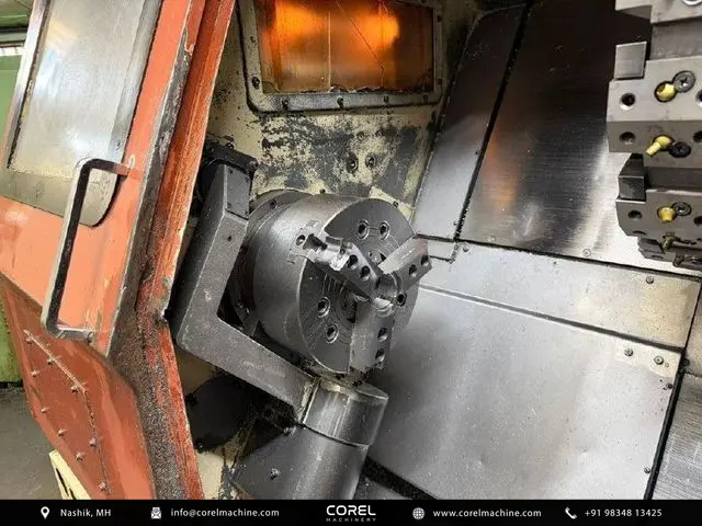 Used OKUMA ACT-3 CNC Turning Centers Slant Bed for sale - Closeup view of the JIS A2-6 spindle and workholding area