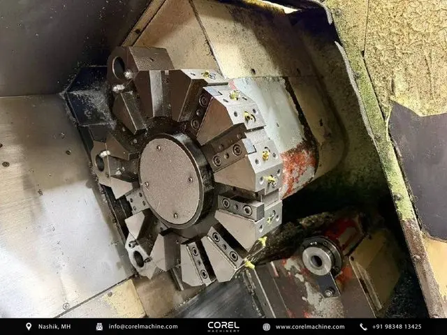 Used OKUMA ACT-3 CNC Turning Centers Slant Bed for sale - Side view showing slant bed guide rails and axis covers